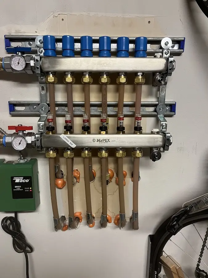 Plumber performing Water Heater Repair at a residential property in Spring